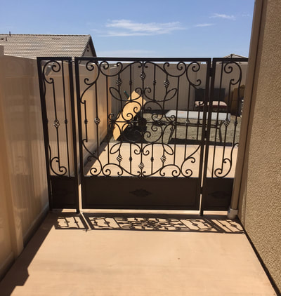 Custom wrought iron side gate installation.