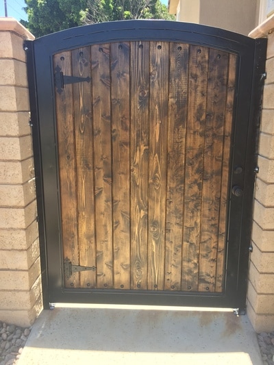 Custom built stained wood side gate.